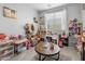 Spacious playroom bathed in natural light, creating a vibrant and inviting atmosphere for children at 17935 W Louise Dr, Surprise, AZ 85387