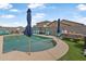 Inviting backyard showcasing a refreshing pool, poolside seating, and low maintenance artificial grass at 17935 W Louise Dr, Surprise, AZ 85387