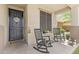 Cozy front porch with rocking chairs, perfect for relaxing and enjoying the outdoors at 17935 W Louise Dr, Surprise, AZ 85387