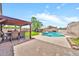 Spacious backyard with covered patio, dining and pool with desert landscaping at 18644 N 21St St, Phoenix, AZ 85024