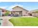The backyard has an artificial lawn, a pergola, and an outdoor dining area at 18644 N 21St St, Phoenix, AZ 85024