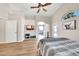Bedroom featuring vaulted ceiling, ceiling fan, and door to backyard at 18644 N 21St St, Phoenix, AZ 85024