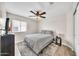 Bedroom with ceiling fan, natural light, and a gray area rug at 18644 N 21St St, Phoenix, AZ 85024