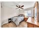 This bedroom features wood floors and a modern ceiling fan with overhead lighting at 18644 N 21St St, Phoenix, AZ 85024
