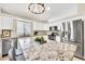 Modern kitchen featuring stainless steel appliances, granite countertops, and a large island with seating at 18644 N 21St St, Phoenix, AZ 85024