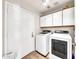 The laundry room has wood floors, a washing machine, and a clothes dryer at 18644 N 21St St, Phoenix, AZ 85024