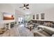 Bright and airy living room with wood-look floors, a comfortable sofa, and access to an outdoor patio at 18644 N 21St St, Phoenix, AZ 85024