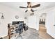Home office with a wooden desk, ergonomic chair, and ceiling fan at 18644 N 21St St, Phoenix, AZ 85024