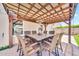 This covered patio offers an outdoor dining area with a large square table at 18644 N 21St St, Phoenix, AZ 85024
