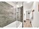 This bathroom has stylish tile, a glass door, and a rainfall shower head at 18644 N 21St St, Phoenix, AZ 85024