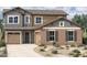 Charming two-story home with a well-maintained desert landscape, offering curb appeal and a welcoming atmosphere at 2014 W Rowel Rd, Phoenix, AZ 85085