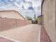 Spacious backyard with gravel, block wall, and a view of neighboring properties at 22986 S 208Th St, Queen Creek, AZ 85142