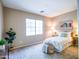 Comfortable bedroom with neutral walls, large window, and stylish decor at 22986 S 208Th St, Queen Creek, AZ 85142