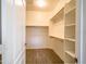 Spacious walk-in closet featuring custom shelving and ample storage space at 22986 S 208Th St, Queen Creek, AZ 85142