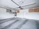 A clean two car garage with lots of ceiling storage, neutral paint and epoxy flooring at 22986 S 208Th St, Queen Creek, AZ 85142