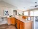Kitchen featuring granite countertops, stainless steel appliances, and a breakfast bar at 22986 S 208Th St, Queen Creek, AZ 85142