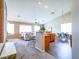 Open-concept living space seamlessly connects the kitchen, dining, and living areas, perfect for entertaining at 22986 S 208Th St, Queen Creek, AZ 85142