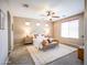 Serene bedroom with ample natural light, a ceiling fan, and a cozy rug at 22986 S 208Th St, Queen Creek, AZ 85142