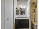 Bathroom features dark vanity, granite countertop, and a door to the toilet and shower at 2301 E University Dr # 488, Mesa, AZ 85213