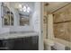 Bathroom featuring dark vanity, granite countertop, toilet and shower/tub combo at 2301 E University Dr # 488, Mesa, AZ 85213