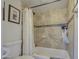Bathroom with shower-tub combination with decorative tile surround and neutral paint at 2301 E University Dr # 488, Mesa, AZ 85213
