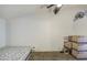 Cozy bedroom featuring neutral carpeting, ceiling fan, and ample space for relaxation at 2301 E University Dr # 488, Mesa, AZ 85213