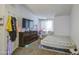 Well-lit bedroom showing a bed, dresser and TV at 2301 E University Dr # 488, Mesa, AZ 85213