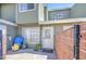 Cozy townhouse entryway with a charming brick-walled patio, perfect for potted plants and outdoor decor at 2301 E University Dr # 488, Mesa, AZ 85213