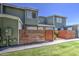 Well-kept two-story townhouse with green exterior, brick accents, and a private front yard area for relaxation at 2301 E University Dr # 488, Mesa, AZ 85213