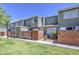 Charming townhouse with well-maintained landscaping, a brick wall, and a private entrance providing a cozy feel at 2301 E University Dr # 488, Mesa, AZ 85213
