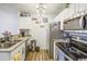 This kitchen features modern stainless steel appliances, granite countertops and ample cabinet space at 2301 E University Dr # 488, Mesa, AZ 85213
