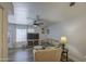 Bright living room with modern flooring, neutral tones, and large windows bringing in lots of natural light at 2301 E University Dr # 488, Mesa, AZ 85213