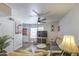 Comfortable living room with light, neutral colors, modern flooring and ceiling fan providing a fresh, modern aesthetic at 2301 E University Dr # 488, Mesa, AZ 85213