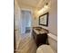 Elegant bathroom features a modern vanity with granite counters, a decorative mirror, and stylish fixtures at 2549 E Desert Trumpet Rd, Phoenix, AZ 85048
