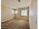 Bedroom featuring beige walls, carpet flooring, and natural lighting at 2549 E Desert Trumpet Rd, Phoenix, AZ 85048