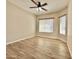 Comfortable bedroom with tile flooring, a ceiling fan, and a bright window for natural light at 2549 E Desert Trumpet Rd, Phoenix, AZ 85048