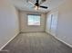 Cozy bedroom featuring plush carpet and a window at 2549 E Desert Trumpet Rd, Phoenix, AZ 85048