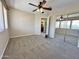 Bedroom featuring carpet, ceiling fan, and a mirror closet door at 2549 E Desert Trumpet Rd, Phoenix, AZ 85048