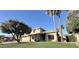Inviting two-story home with manicured lawn, desert landscaping, tile roof, and bright natural light at 2549 E Desert Trumpet Rd, Phoenix, AZ 85048