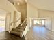 Inviting foyer with staircase and tile flooring, leading to a bright and spacious living area at 2549 E Desert Trumpet Rd, Phoenix, AZ 85048