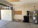 Well-organized garage featuring storage cabinets, a water heater, and a water filtration system at 2549 E Desert Trumpet Rd, Phoenix, AZ 85048