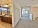 Hallway leading to a bathroom and large room with lots of natural light at 2549 E Desert Trumpet Rd, Phoenix, AZ 85048