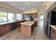 Spacious kitchen with granite countertops, stainless steel appliances, and a large island for entertaining at 2549 E Desert Trumpet Rd, Phoenix, AZ 85048
