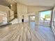 Spacious living area with tile flooring, soaring ceilings, and ample natural light, enhanced by a staircase feature at 2549 E Desert Trumpet Rd, Phoenix, AZ 85048