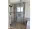Tile shower with glass doors at 2549 E Desert Trumpet Rd, Phoenix, AZ 85048