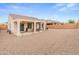 The home features a covered patio and spacious backyard, ideal for outdoor activities and relaxation at 25947 W Oraibi Dr, Buckeye, AZ 85396