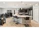 Stylish kitchen with an open concept and a large island with seating, seamlessly flowing into the dining and living areas at 25947 W Oraibi Dr, Buckeye, AZ 85396