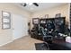 Well-appointed home office with built-in shelving, workspace, and comfortable chair for productive remote work at 25947 W Oraibi Dr, Buckeye, AZ 85396