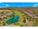 Scenic aerial view highlighting a lake, golf course, and the surrounding residential area at 27057 W Tonopah Dr, Buckeye, AZ 85396