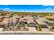 Expansive aerial view of the community showcasing well-maintained homes and desert landscape at 27057 W Tonopah Dr, Buckeye, AZ 85396